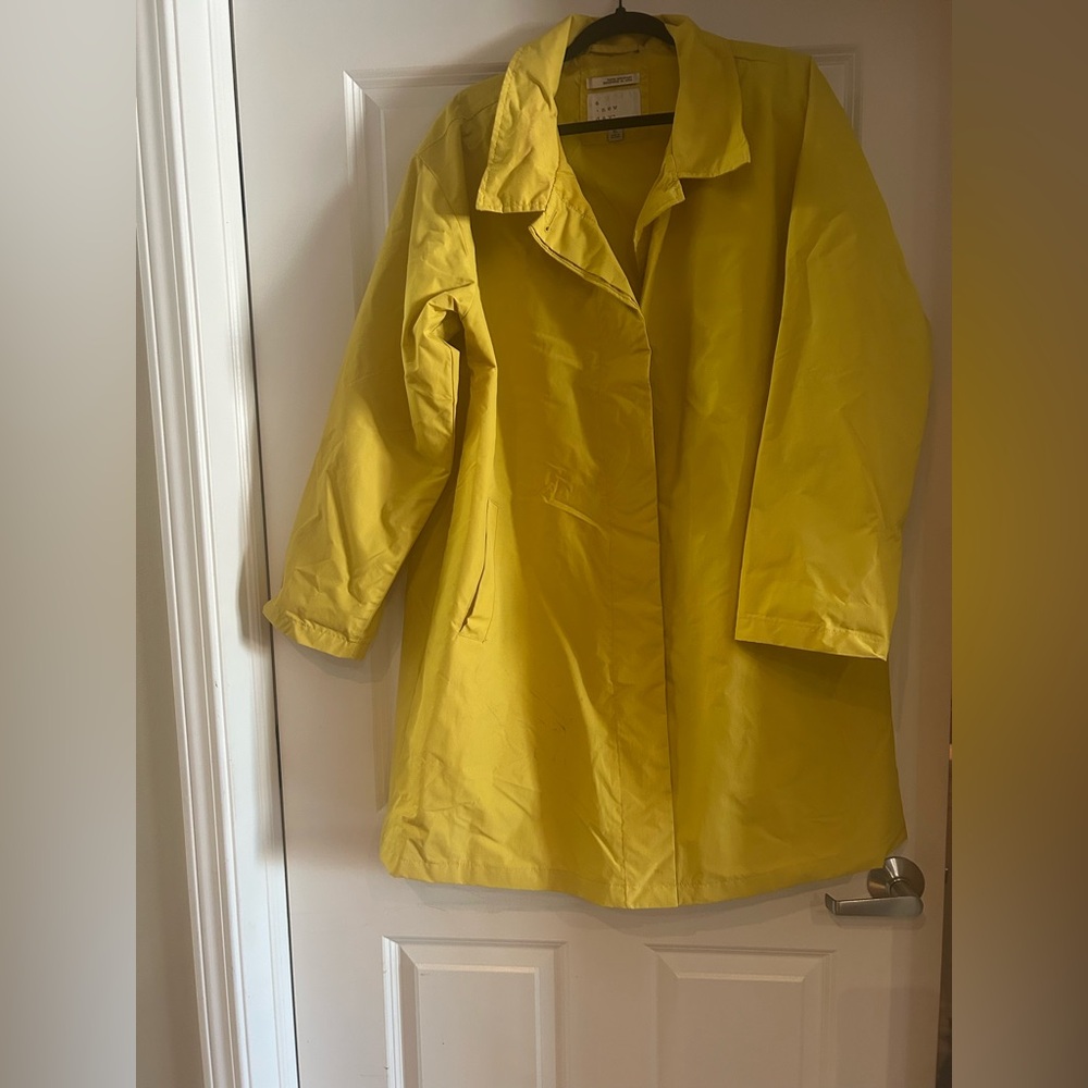 Yellow “a new day” raincoat